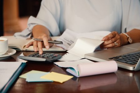 entrepreneur-working-with-bills (1) (1) (1)